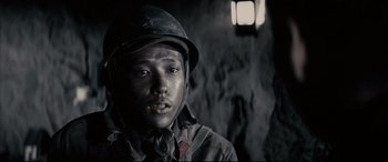 Movie still from “Letters from Iwo Jima” (2006), directed by Clint Eastwood – A man wearing a hat and a jacket; Close Up shot, High angle