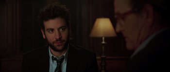 A person wearing a suit and tie