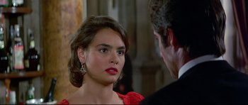 Movie still from “Licence to Kill” (1989), directed by John Glen – A man and a woman talking to each other; Close Up shot, Over the shoulder angle