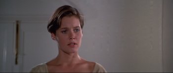 Movie still from “Licence to Kill” (1989), directed by John Glen – A person with short brown hair; Close Up shot, Over the shoulder angle