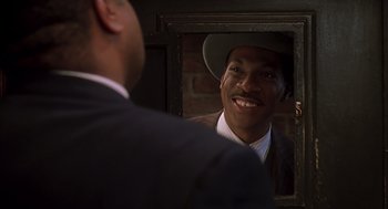 Movie still from “Life” (1999), directed by Ted Demme – A man looking at himself in the mirror; Close Up shot, Over the shoulder angle