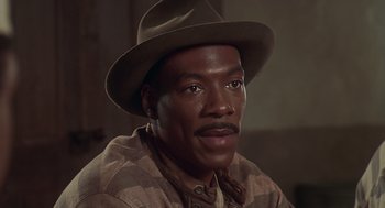 Movie still from “Life” (1999), directed by Ted Demme – A person wearing a hat; Close Up shot, High angle