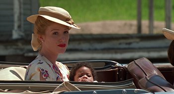 Movie still from “Life” (1999), directed by Ted Demme – A woman and a baby in a carriage; Close Up shot, Over the shoulder angle
