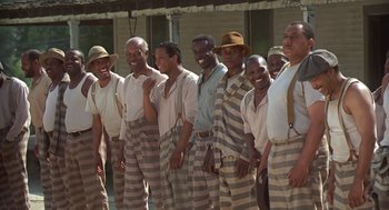 Movie still from “Life” (1999), directed by Ted Demme – A group of men standing next to each other; Wide shot, High angle