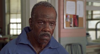 Movie still from “Life” (1999), directed by Ted Demme – An older man is looking at the camera; Close Up shot, Low angle