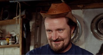 Movie still from “Life Is Sweet” (1990), directed by Mike Leigh – A person wearing a cowboy hat; Close Up shot, Low angle
