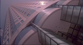 Movie still from “Life Stinks” (1991), directed by Mel Brooks – A very tall building that has many windows on it's side; Extreme Wide shot, Low angle