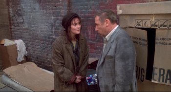 Movie still from “Life Stinks” (1991), directed by Mel Brooks – A man and a woman talking to each other outside; Medium shot, Over the shoulder angle