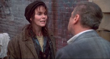 Movie still from “Life Stinks” (1991), directed by Mel Brooks – A man and a woman talking to each other; Medium shot, Over the shoulder angle