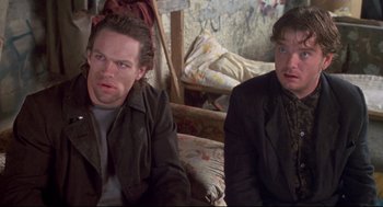 Movie still from “Life Stinks” (1991), directed by Mel Brooks – Two men sitting next to each other in a room; Close Up shot, Low angle