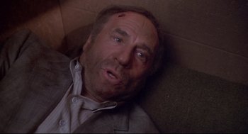 Movie still from “Life Stinks” (1991), directed by Mel Brooks – A person laying on the ground; Close Up shot, Overhead angle