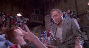 Movie still from “Life Stinks” (1991), directed by Mel Brooks – An older man sitting in front of a young woman; Medium shot, Low angle