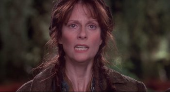Movie still from “Life Stinks” (1991), directed by Mel Brooks – A person with long red hair; Close Up shot, Over the shoulder angle