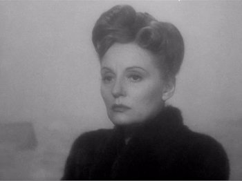 Movie still from “Lifeboat” (1944), directed by Alfred Hitchcock – An old photo of an older woman in a fur coat; Close Up shot, Low angle