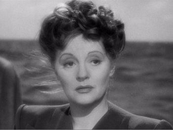 Movie still from “Lifeboat” (1944), directed by Alfred Hitchcock – An old black and white photo of a woman; Close Up shot, High angle