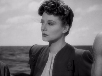 Movie still from “Lifeboat” (1944), directed by Alfred Hitchcock – An old black and white photo of a woman; Close Up shot, Low angle