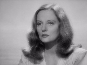 Movie still from “Lifeboat” (1944), directed by Alfred Hitchcock – A black - and - white photo of a woman with long hair; Close Up shot, Low angle