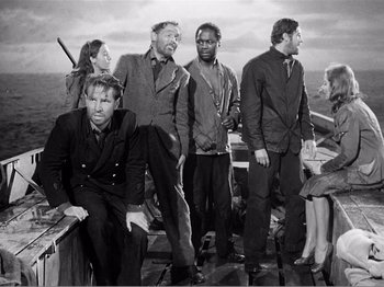 Movie still from “Lifeboat” (1944), directed by Alfred Hitchcock – A black and white photo of people on a boat; Wide shot, High angle