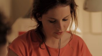 Movie still from “Like Crazy” (2011), directed by Drake Doremus – A person wearing a red shirt; Close Up shot, Over the shoulder angle