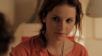 Movie still from “Like Crazy” (2011), directed by Drake Doremus – A person wearing a red shirt; Close Up shot, Over the shoulder angle