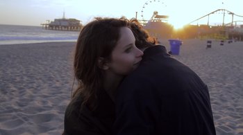 Movie still from “Like Crazy” (2011), directed by Drake Doremus – A woman and a man hugging on the beach; Close Up shot, Over the shoulder angle