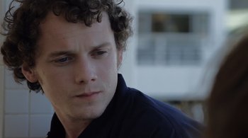 Movie still from “Like Crazy” (2011), directed by Drake Doremus – A person with curly hair; Close Up shot, Over the shoulder angle