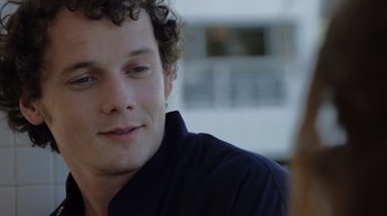 Movie still from “Like Crazy” (2011), directed by Drake Doremus – A person with curly brown hair; Close Up shot, Over the shoulder angle