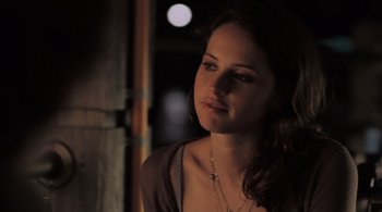Movie still from “Like Crazy” (2011), directed by Drake Doremus – A beautiful young lady wearing a brown shirt; Close Up shot, Over the shoulder angle
