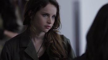 Movie still from “Like Crazy” (2011), directed by Drake Doremus – A beautiful young lady with long brown hair; Close Up shot, Over the shoulder angle