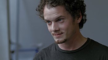 Movie still from “Like Crazy” (2011), directed by Drake Doremus – A person wearing a black shirt; Close Up shot, Over the shoulder angle