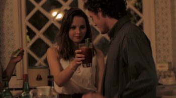 Movie still from “Like Crazy” (2011), directed by Drake Doremus – A man and a woman are holding a glass of juice; Close Up shot, Over the shoulder angle