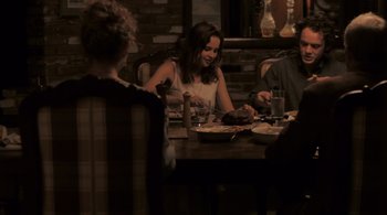 Movie still from “Like Crazy” (2011), directed by Drake Doremus – A group of people sitting at a table eating food; Medium shot, High angle