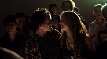 Movie still from “Like Crazy” (2011), directed by Drake Doremus – A man and a woman standing next to each other in a crowd; Close Up shot, Low angle