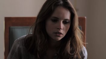 Movie still from “Like Crazy” (2011), directed by Drake Doremus – A person with long brown hair; Close Up shot, Over the shoulder angle