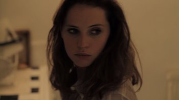 Movie still from “Like Crazy” (2011), directed by Drake Doremus – A woman with long brown hair is looking at the camera; Close Up shot, High angle