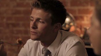 Movie still from “Like Crazy” (2011), directed by Drake Doremus – A man wearing a white shirt and a tie; Close Up shot, Over the shoulder angle