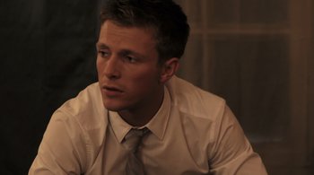 Movie still from “Like Crazy” (2011), directed by Drake Doremus – A man wearing a white shirt and a tie; Close Up shot, Over the shoulder angle