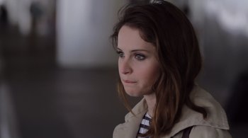 Movie still from “Like Crazy” (2011), directed by Drake Doremus – A person wearing a jacket; Close Up shot, Over the shoulder angle