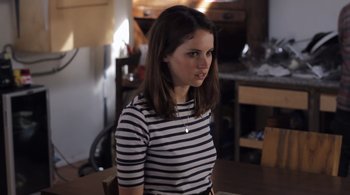 Movie still from “Like Crazy” (2011), directed by Drake Doremus – A woman sitting at a table in front of a window; Medium shot, Over the shoulder angle