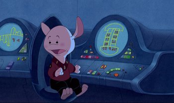 Movie still from “Lilo & Stitch” (2002), directed by Dean DeBlois – A cartoon pig sitting in front of a computer screen; Medium shot, High angle