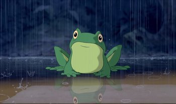Movie still from “Lilo & Stitch” (2002), directed by Dean DeBlois – A cartoon frog sitting in the middle of a rain storm; Wide shot, Low angle