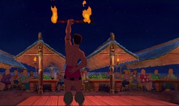 Movie still from “Lilo & Stitch” (2002), directed by Dean DeBlois – An animated scene of a man holding a pole with torches in it; Wide shot, Over the shoulder angle
