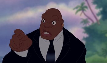 Movie still from “Lilo & Stitch” (2002), directed by Dean DeBlois – An image of an animated character in a suit and tie; Close Up shot, Low angle
