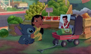 Movie still from “Lilo & Stitch” (2002), directed by Dean DeBlois – An image of lilo and stitch in a market scene; Wide shot, Over the shoulder angle