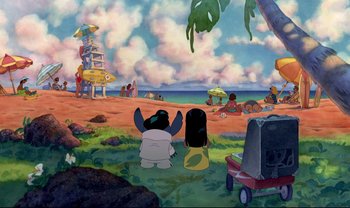 Movie still from “Lilo & Stitch” (2002), directed by Dean DeBlois – A painting of a beach scene with a couple of people sitting on the ground; Extreme Wide shot, High angle