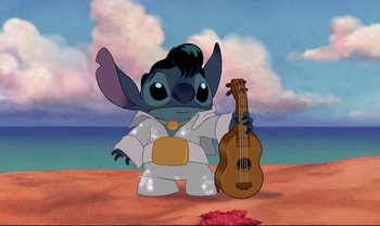 Movie still from “Lilo & Stitch” (2002), directed by Dean DeBlois – A picture of a person holding a ukulele; Wide shot, Low angle