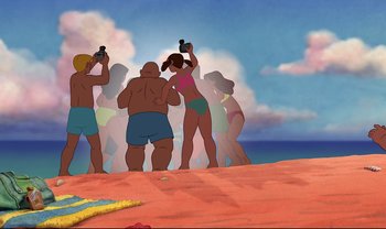 Movie still from “Lilo & Stitch” (2002), directed by Dean DeBlois – A group of people standing on top of a sandy beach; Extreme Wide shot, Low angle