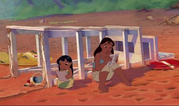 Movie still from “Lilo & Stitch” (2002), directed by Dean DeBlois – Two animated women sitting on the ground reading; Wide shot, High angle