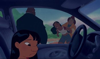 Movie still from “Lilo & Stitch” (2002), directed by Dean DeBlois – A group of people standing in a car next to each other; Medium shot, Over the shoulder angle