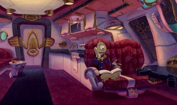 Movie still from “Lilo & Stitch” (2002), directed by Dean DeBlois – An alien sitting on a red chair in a room; Wide shot, High angle